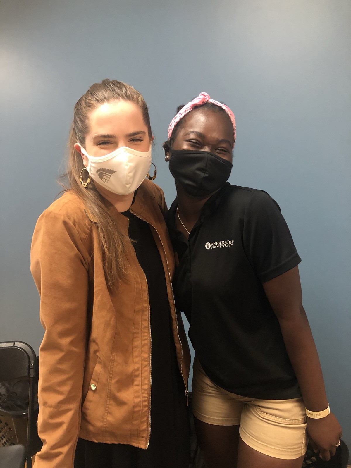 Ceci with a colleague during COVID-era New Student Orientation — masked but still showing up
